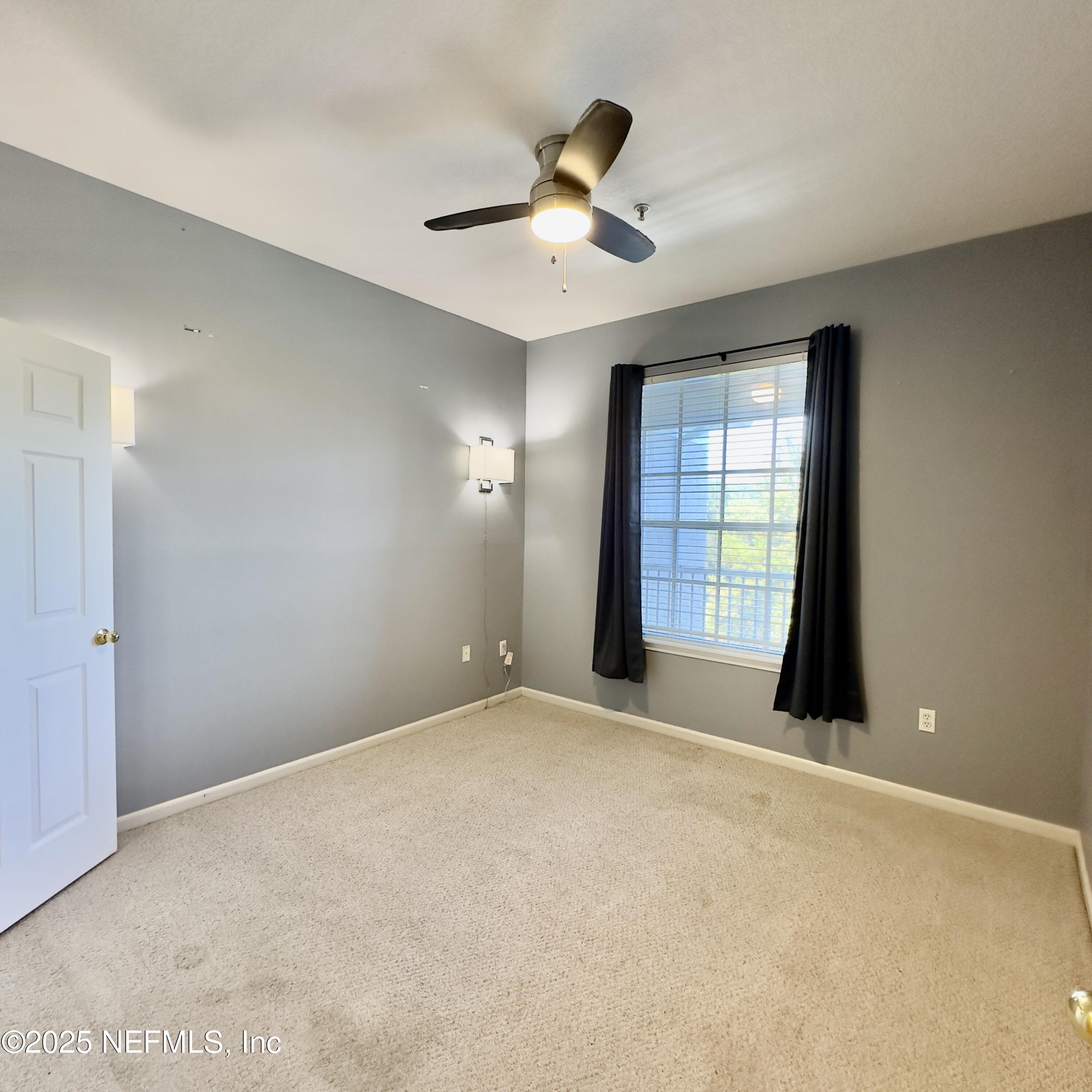 10550 Baymeadows Road, Unit 512 Jacksonville, FL 32256 - Photo 13 of 24 a view of an empty room with a window