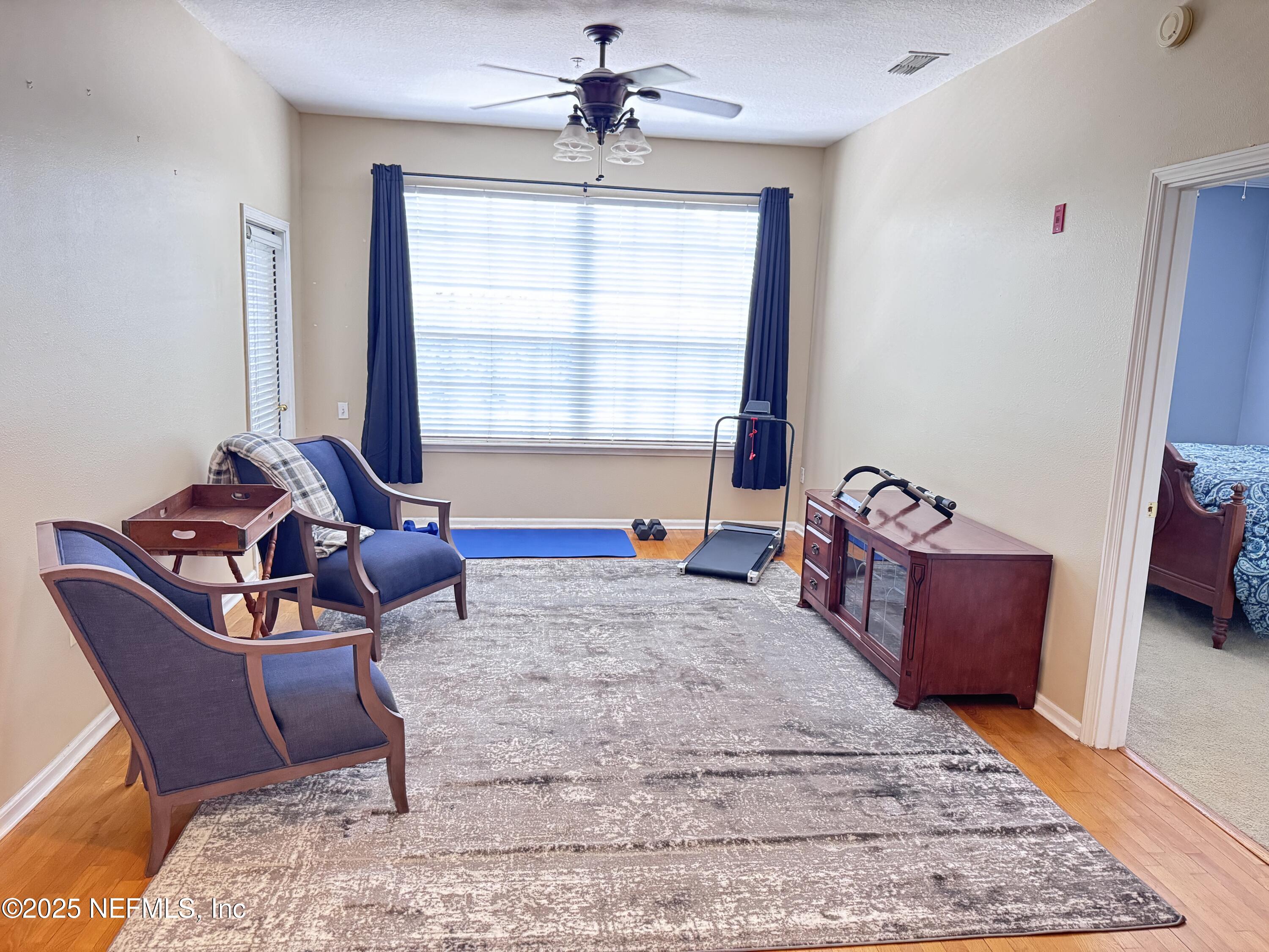 10550 Baymeadows Road, Unit 512 Jacksonville, FL 32256 - Photo 2 of 24 a living room with furniture and a window