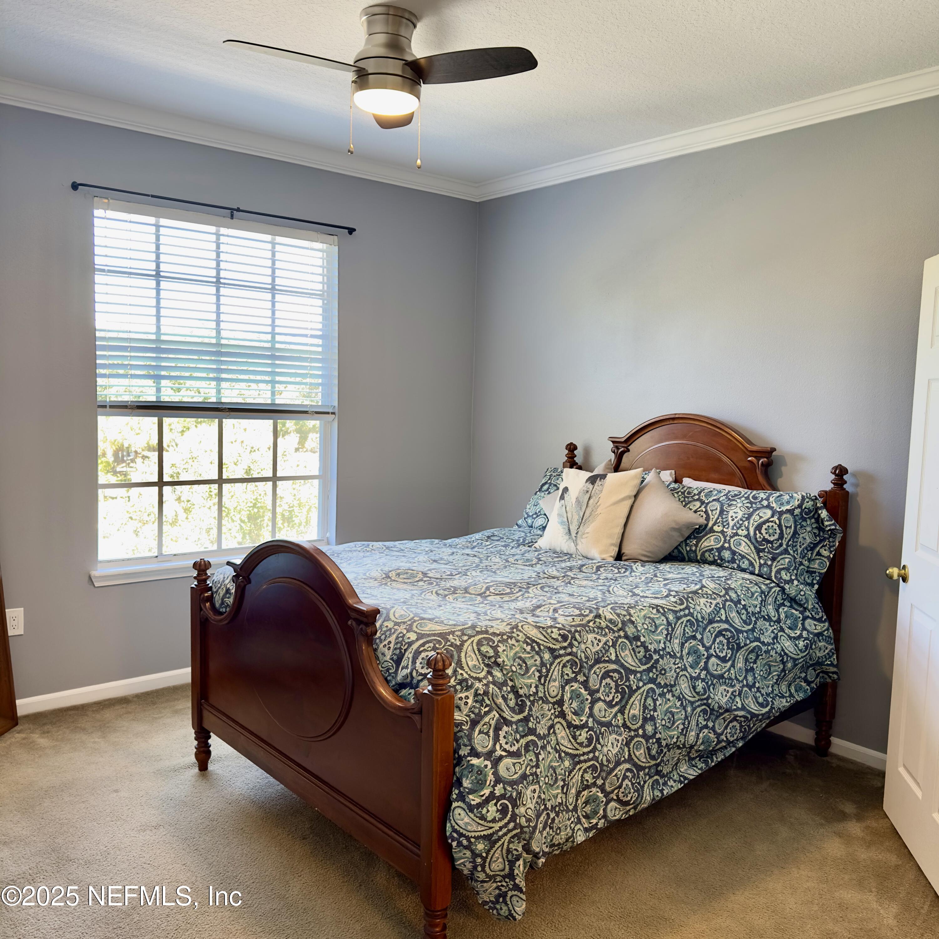 10550 Baymeadows Road, Unit 512 Jacksonville, FL 32256 - Photo 8 of 24 a bedroom with a bed and window
