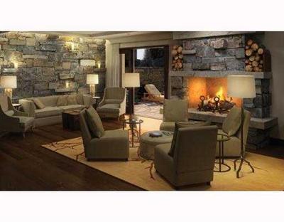 1 Vail Road, Unit 7201 Vail, CO 81657 - Photo 4 of 9 a living room with furniture and a flat screen tv