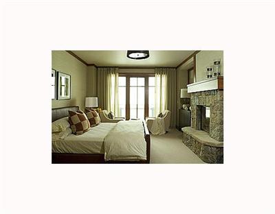 1 Vail Road, Unit 7201 Vail, CO 81657 - Photo 9 of 9 a living room with furniture and a fireplace