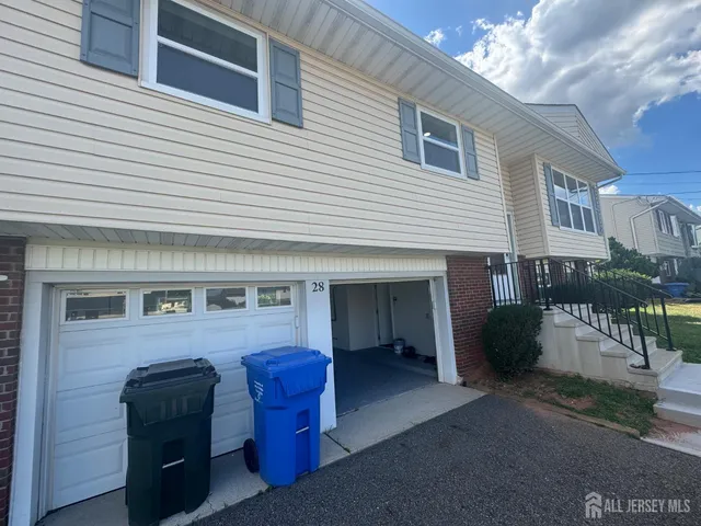 a view of a house with a barbeque grill and a fireplace