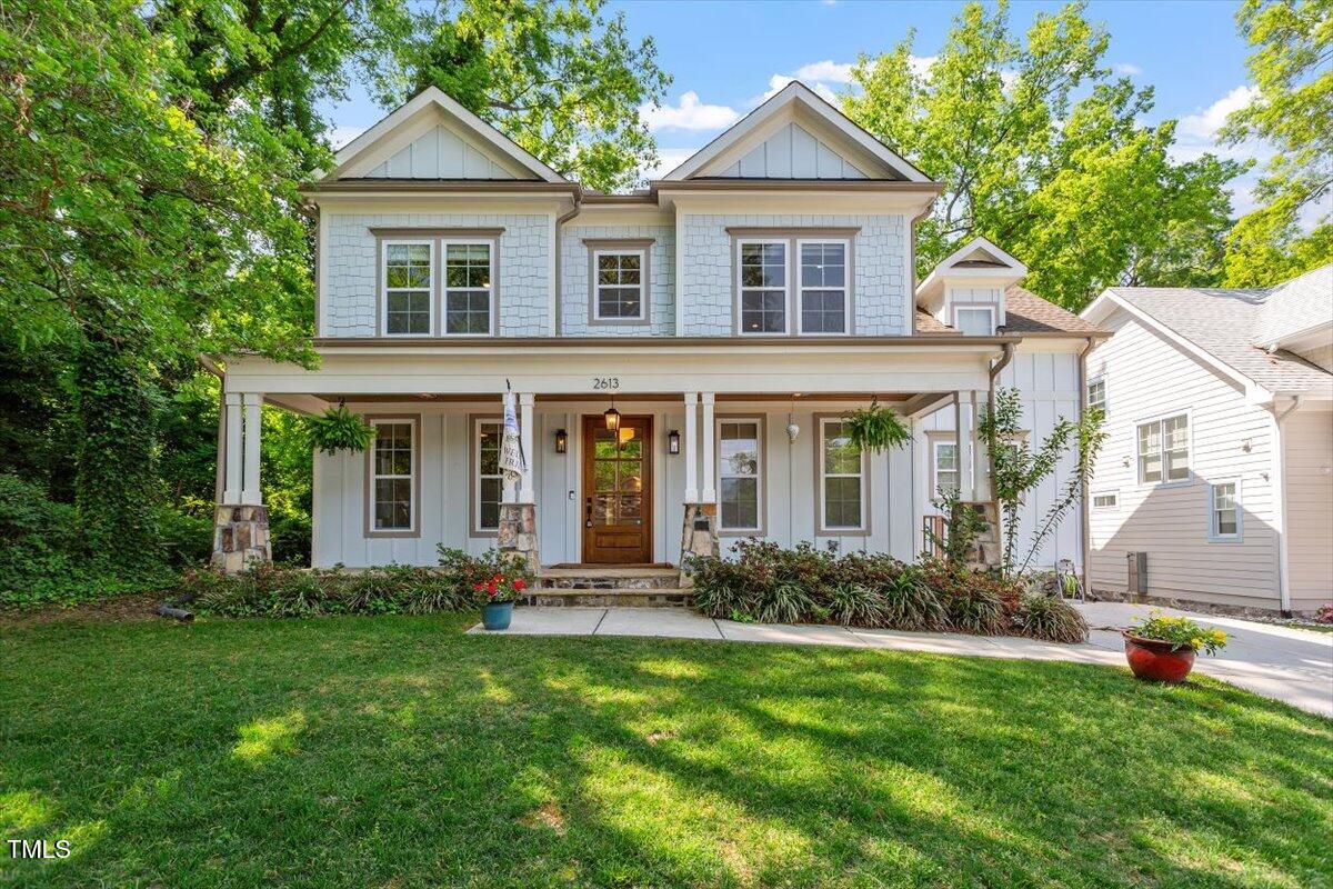 2613 Bedford Avenue Raleigh, NC 27607 - Photo 1 of 44 a front view of a house with a yard