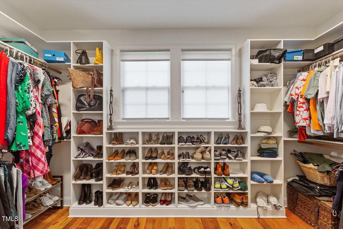 2613 Bedford Avenue Raleigh, NC 27607 - Photo 20 of 44 a view of walk in closet with clothes and shoes