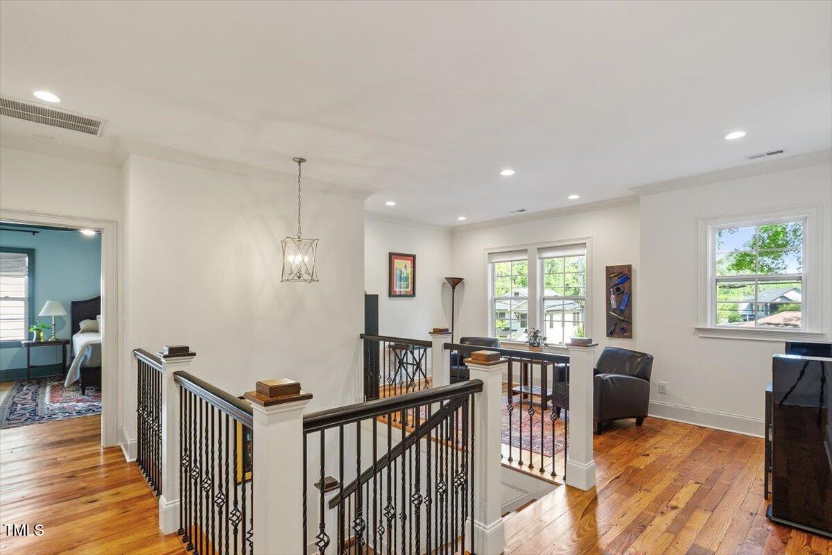 2613 Bedford Avenue Raleigh, NC 27607 - Photo 21 of 44 a living room with furniture a flat screen tv and a large window