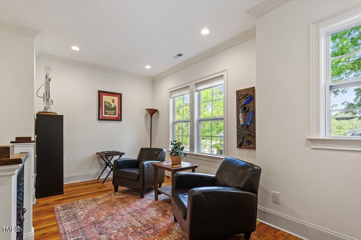 2613 Bedford Avenue Raleigh, NC 27607 - Photo 22 of 44 a living room with furniture and a window