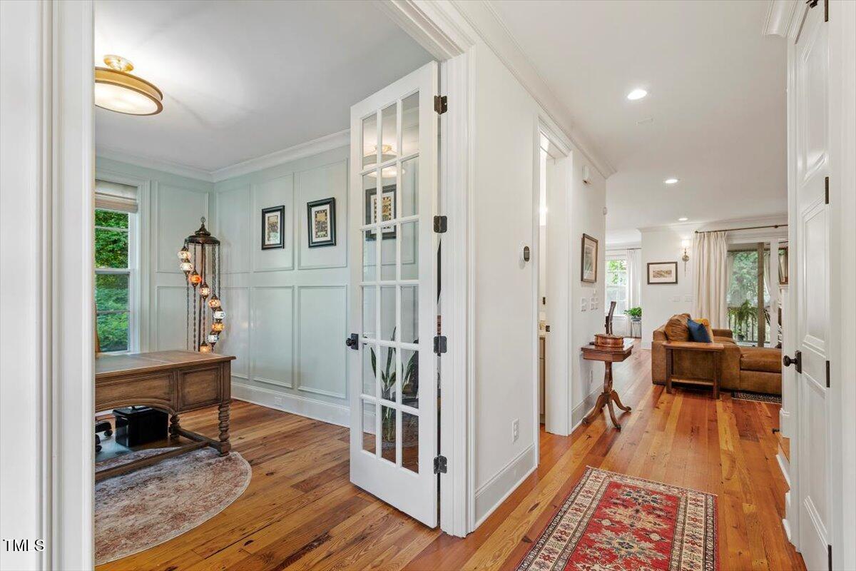 2613 Bedford Avenue Raleigh, NC 27607 - Photo 5 of 44 a living room with furniture and a wooden floor