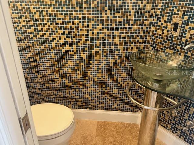 9768 Bay Vista Estates Boulevard Orlando, FL 32836 - Photo 16 of 28 a bathroom with a sink toilet and shower