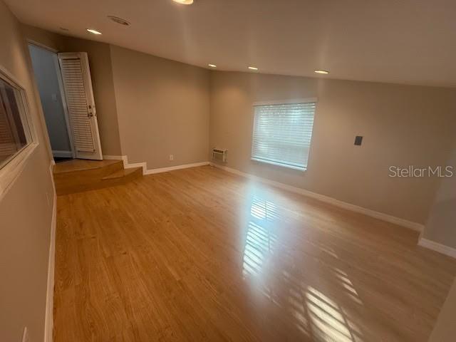 9768 Bay Vista Estates Boulevard Orlando, FL 32836 - Photo 20 of 28 an empty room with wooden floor and windows