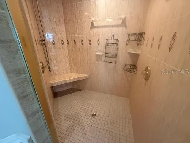 a bathroom with a granite countertop sink a toilet and bathtub