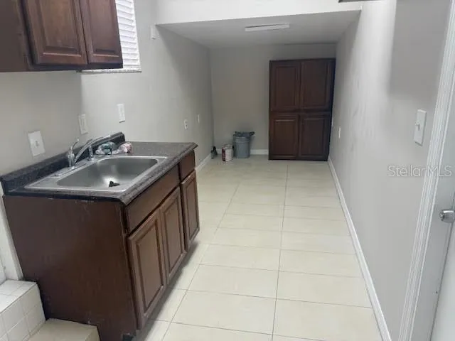 a bathroom with a sink and washing machine