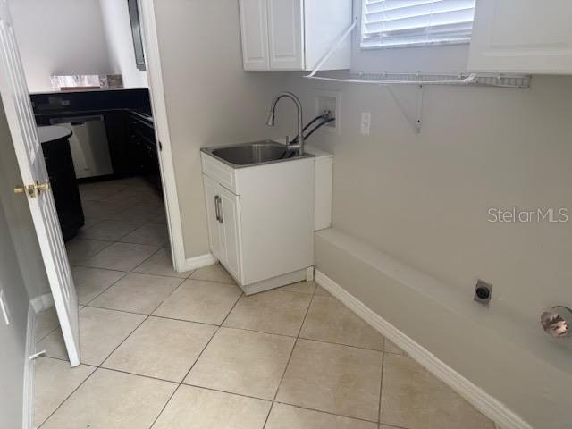 9768 Bay Vista Estates Boulevard Orlando, FL 32836 - Photo 25 of 28 a bathroom with a sink and washing machine