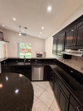 a kitchen with a sink and stove