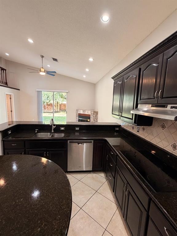 9768 Bay Vista Estates Boulevard Orlando, FL 32836 - Photo 5 of 28 a kitchen with a sink and stove