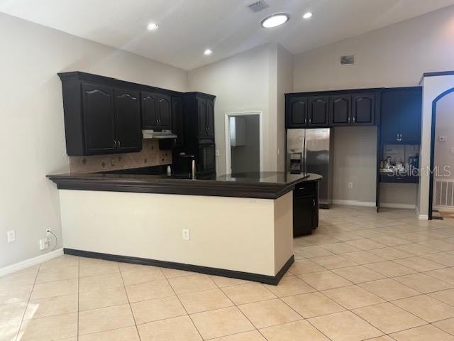 9768 Bay Vista Estates Boulevard Orlando, FL 32836 - Photo 7 of 28 a kitchen with kitchen island a counter top space cabinets and stainless steel appliances