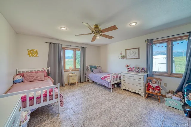 a bedroom with furniture and a window