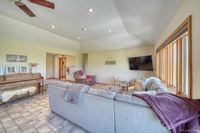 a living room with furniture and a window