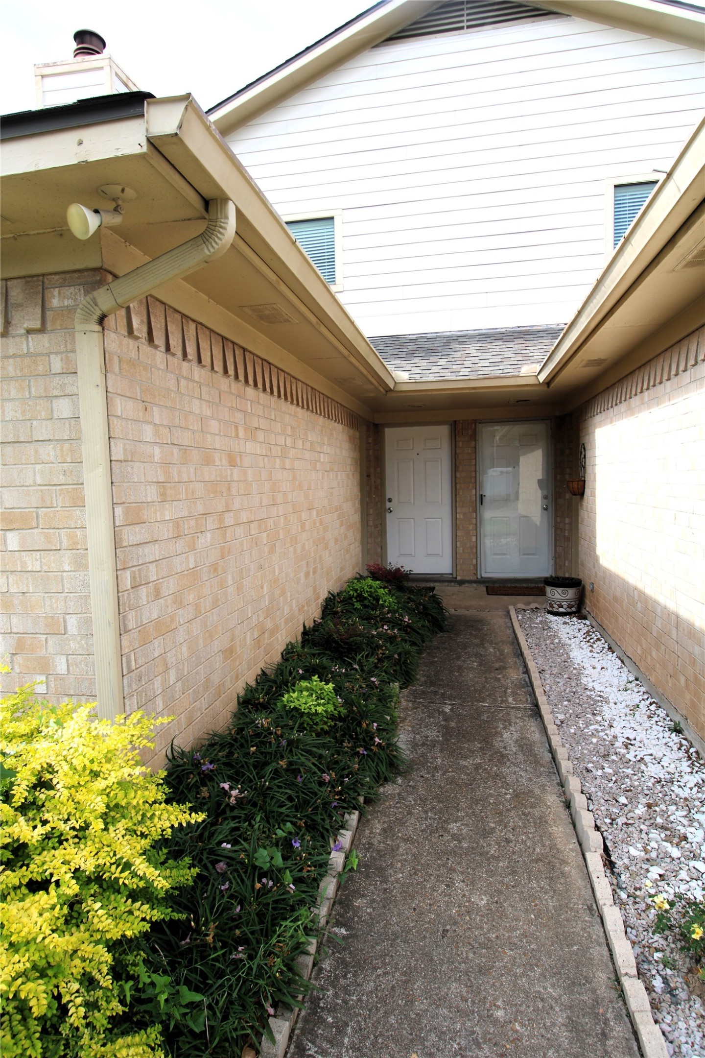 1101 Wilson Drive Rosenberg, TX 77471 - Photo 3 of 38 DUPLEX ON LEFT SIDE & NICE FLOWERS!