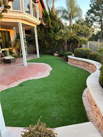 a view of a house with a yard porch and sitting area