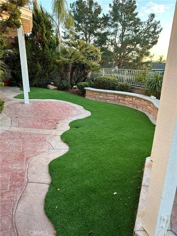 a view of a park with large trees
