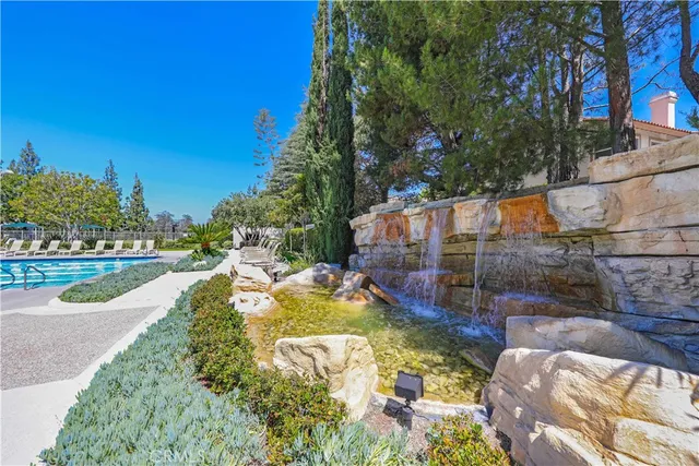 a view of a swimming pool with a patio