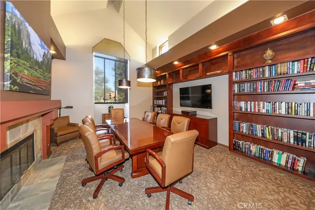 a view of a livingroom with furniture and a bookshelf