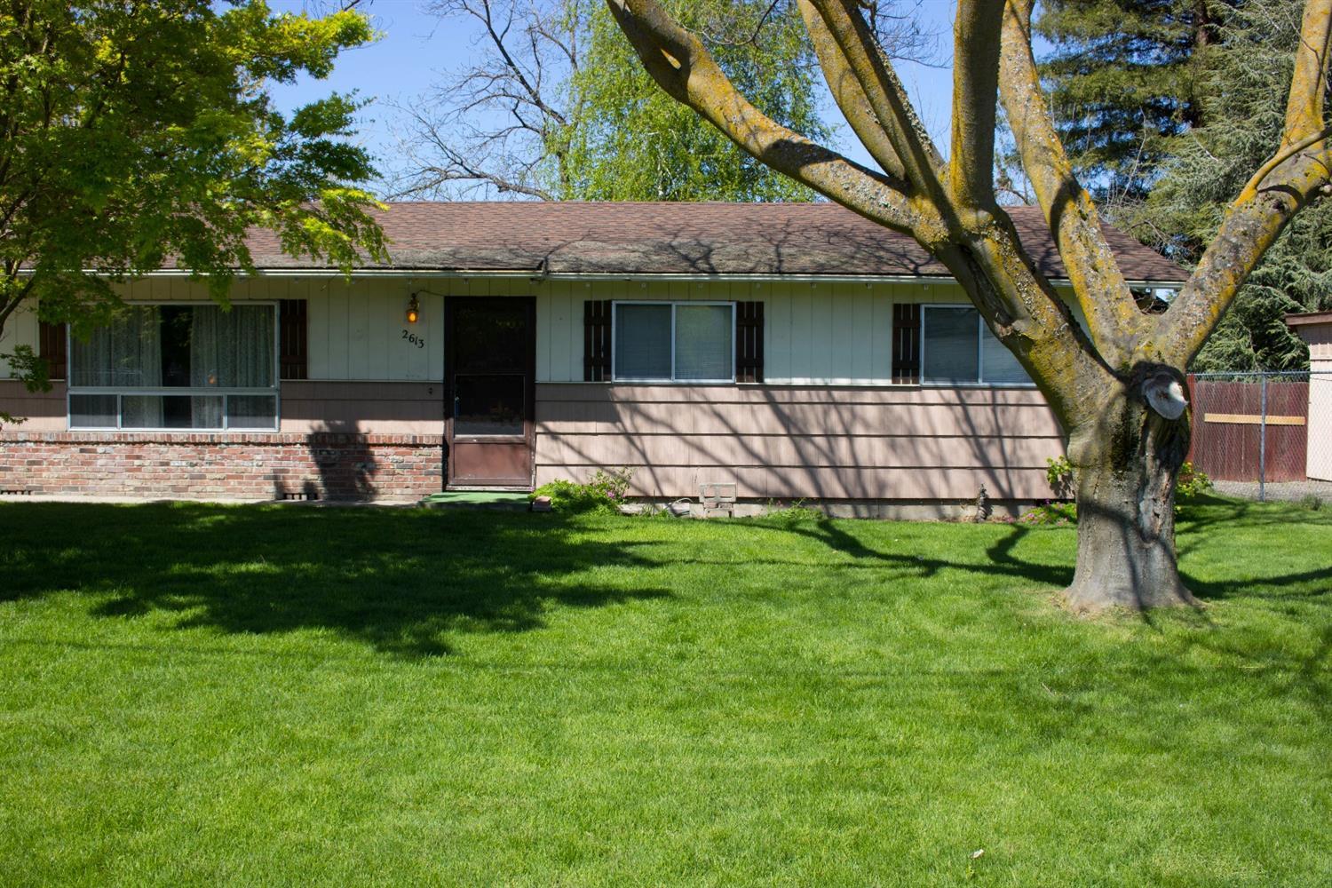 2613 Table Rock Road Medford, OR 97501 - Photo 19 of 23 a view of a house with a yard and a large tree