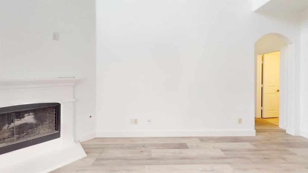 101 Rocky Pine Road McKinney, TX 75072 - Photo 14 of 39 a view of a livingroom with wooden floor and a fireplace