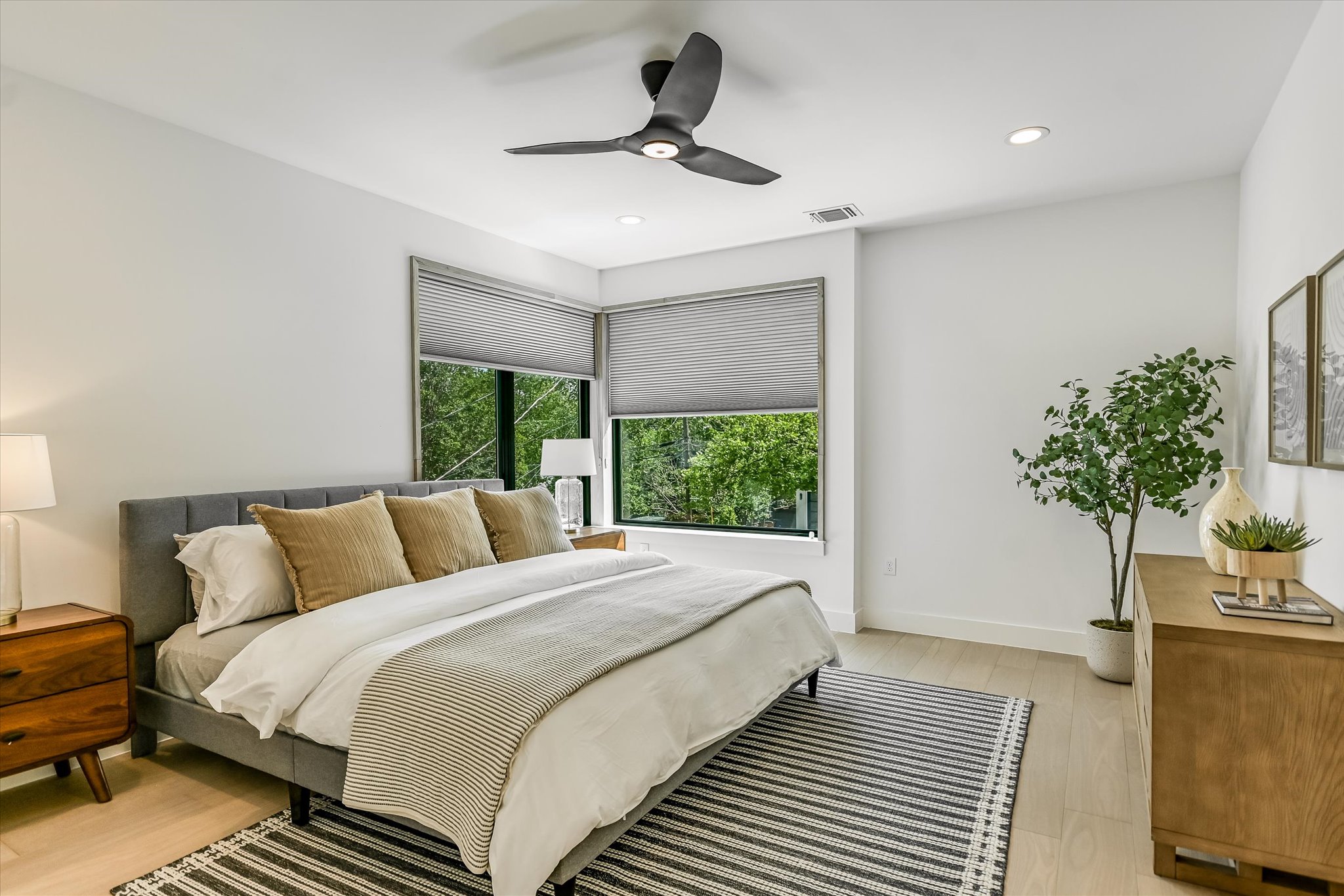1712 Nash Avenue, Unit A Austin, TX 78704 - Photo 15 of 38 a bedroom with a bed and a potted plant