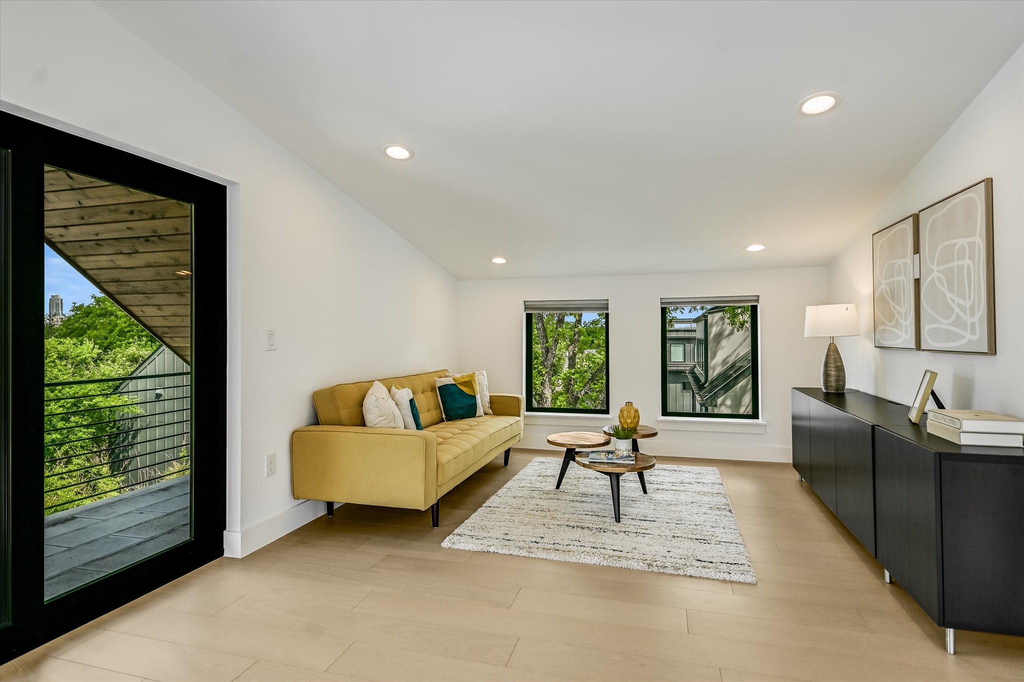 1712 Nash Avenue, Unit A Austin, TX 78704 - Photo 21 of 38 a living room with furniture and a large window