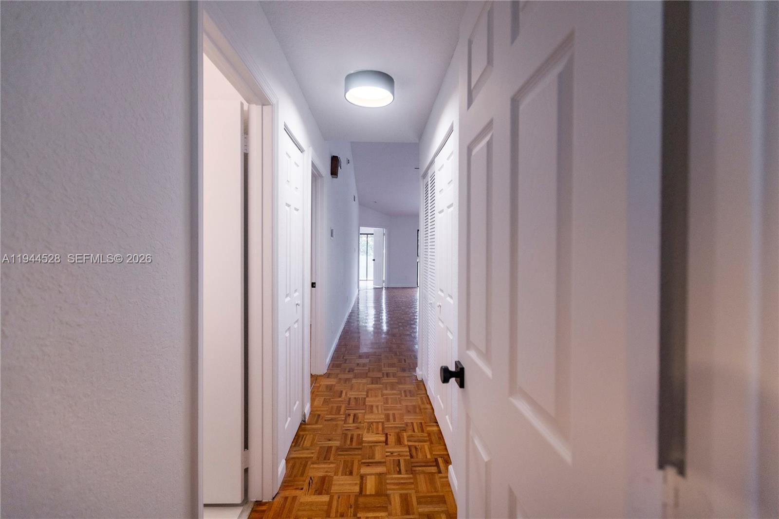 8775 Southwest 57th Street Cooper City, FL 33328 - Photo 26 of 35 Hallway from 2nd Bedroom