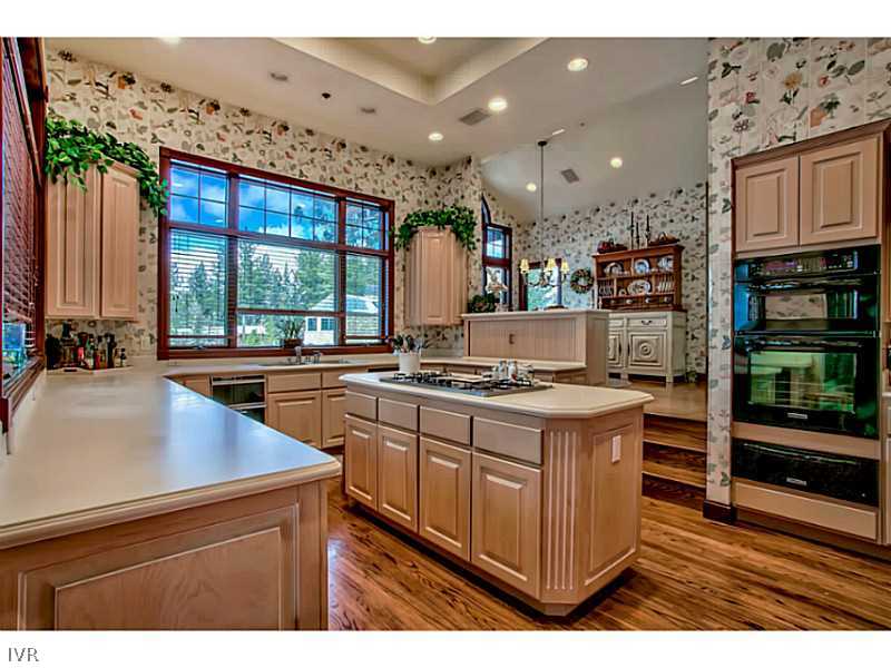1155 Lakeshore Boulevard Incline Village, NV 89451 - Photo 5 of 18 a kitchen with stainless steel appliances granite countertop a stove a sink and a refrigerator