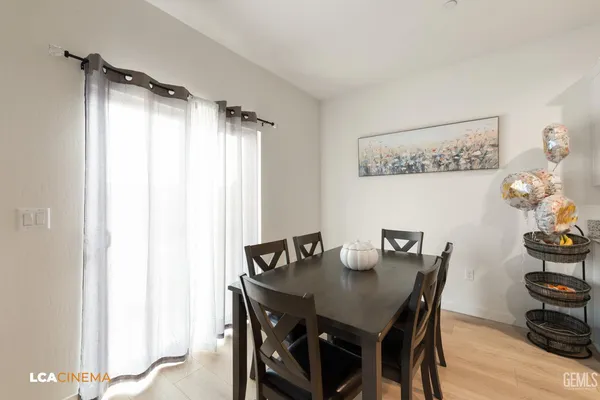 a view of a dining room that has a table and chairs in it