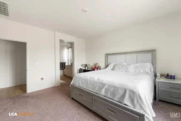 a bedroom with a bed and a closet