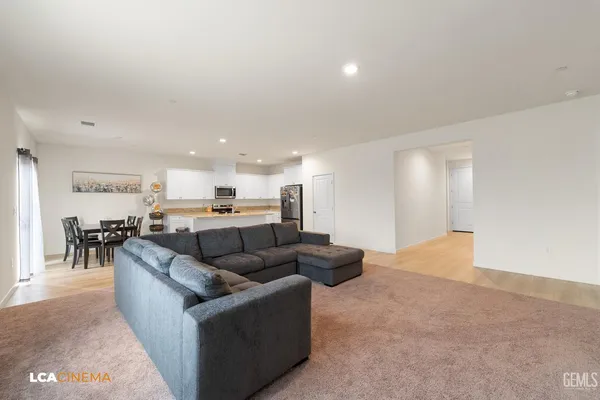 a living room with furniture and a table