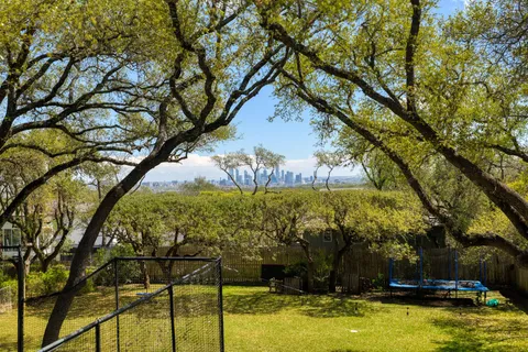 a view of swimming pool with a yard
