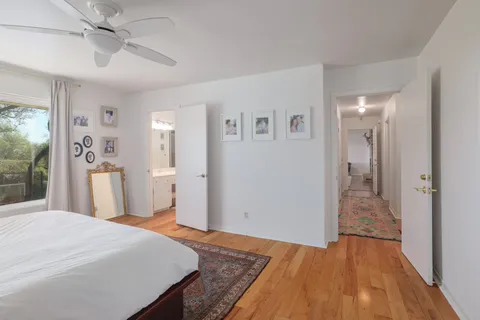 a bedroom with furniture and window