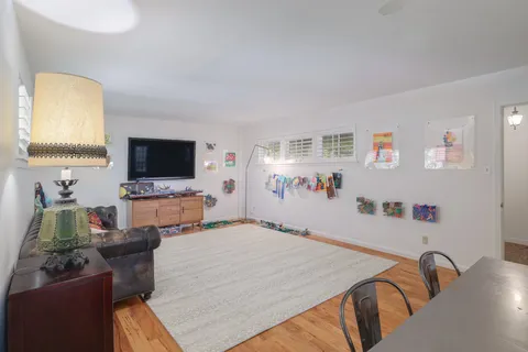 a room with furniture and a flat screen tv