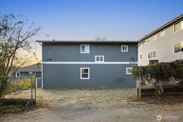 a backyard of a house with plants and trees