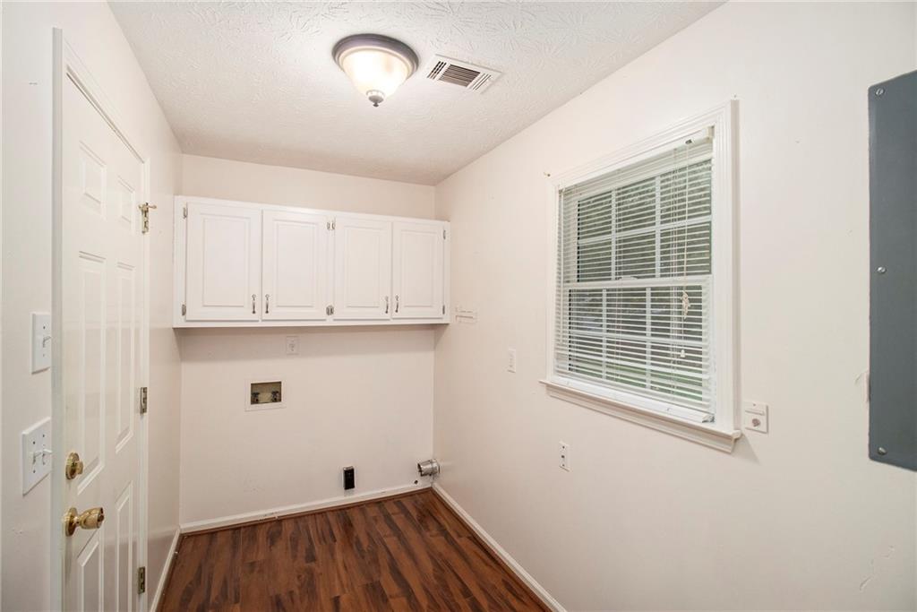340 Radcliff Trace Covington, GA 30016 - Photo 15 of 38 a view of storage and utility room with wooden floor