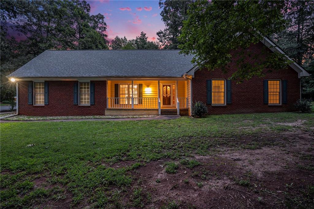 340 Radcliff Trace Covington, GA 30016 - Photo 2 of 38 a front view of house with yard and green space