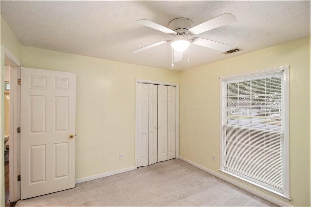 340 Radcliff Trace Covington, GA 30016 - Photo 21 of 38 a view of an empty room with a window