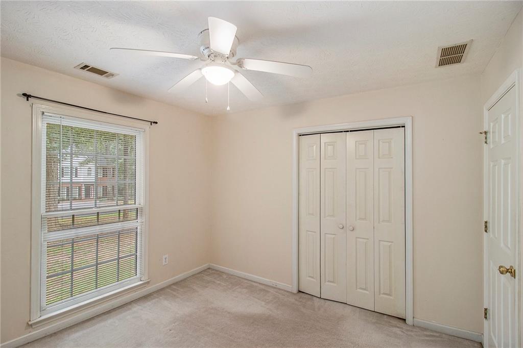 340 Radcliff Trace Covington, GA 30016 - Photo 23 of 38 an empty room with chandelier fan