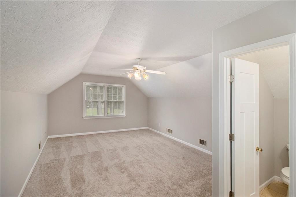 340 Radcliff Trace Covington, GA 30016 - Photo 25 of 38 a view of an empty room with a window