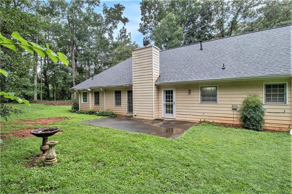 340 Radcliff Trace Covington, GA 30016 - Photo 28 of 38 a view of a house with a yard and sitting area
