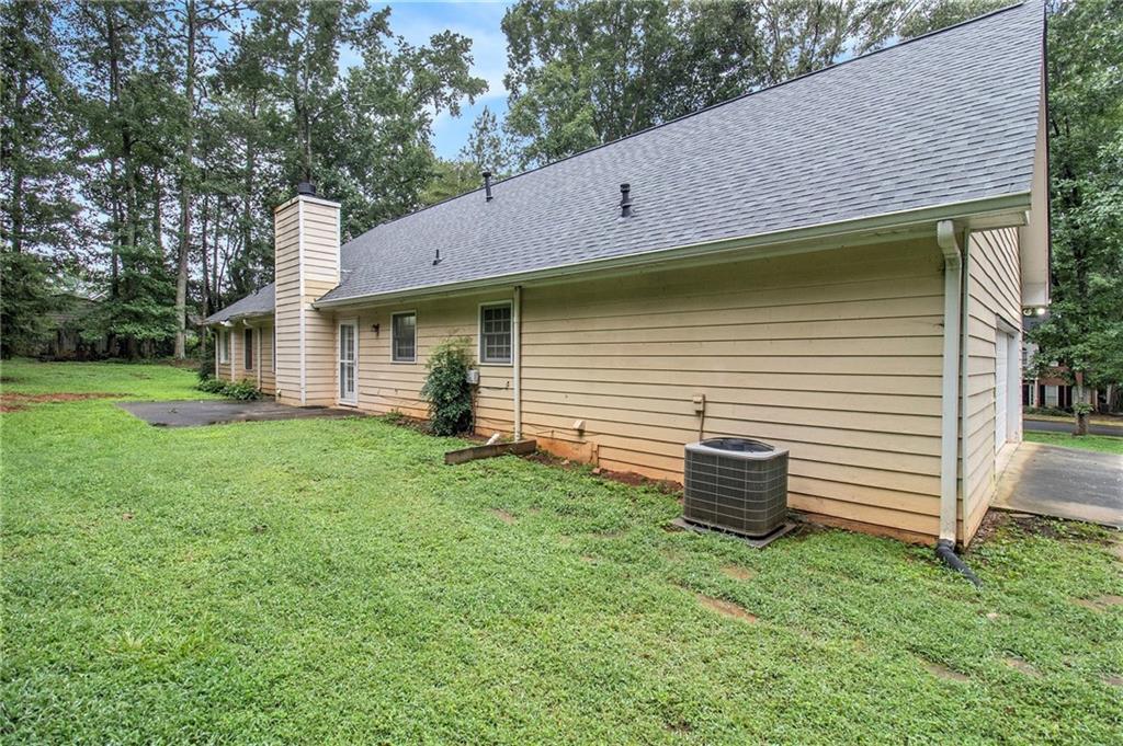 340 Radcliff Trace Covington, GA 30016 - Photo 29 of 38 a view of a backyard with plants and large tree