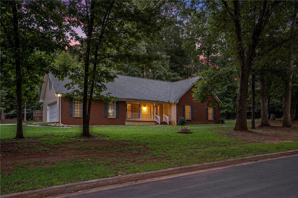 340 Radcliff Trace Covington, GA 30016 - Photo 30 of 38 a front view of a house with a yard