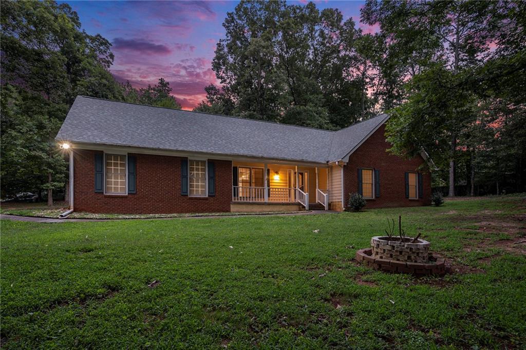 340 Radcliff Trace Covington, GA 30016 - Photo 32 of 38 a view of a house with a backyard
