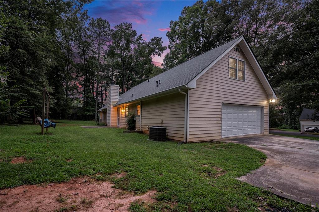 340 Radcliff Trace Covington, GA 30016 - Photo 34 of 38 a front view of house with a garden