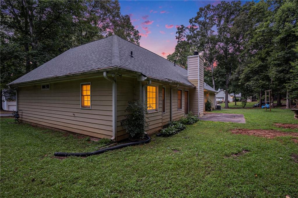 340 Radcliff Trace Covington, GA 30016 - Photo 35 of 38 a front view of a house with a yard